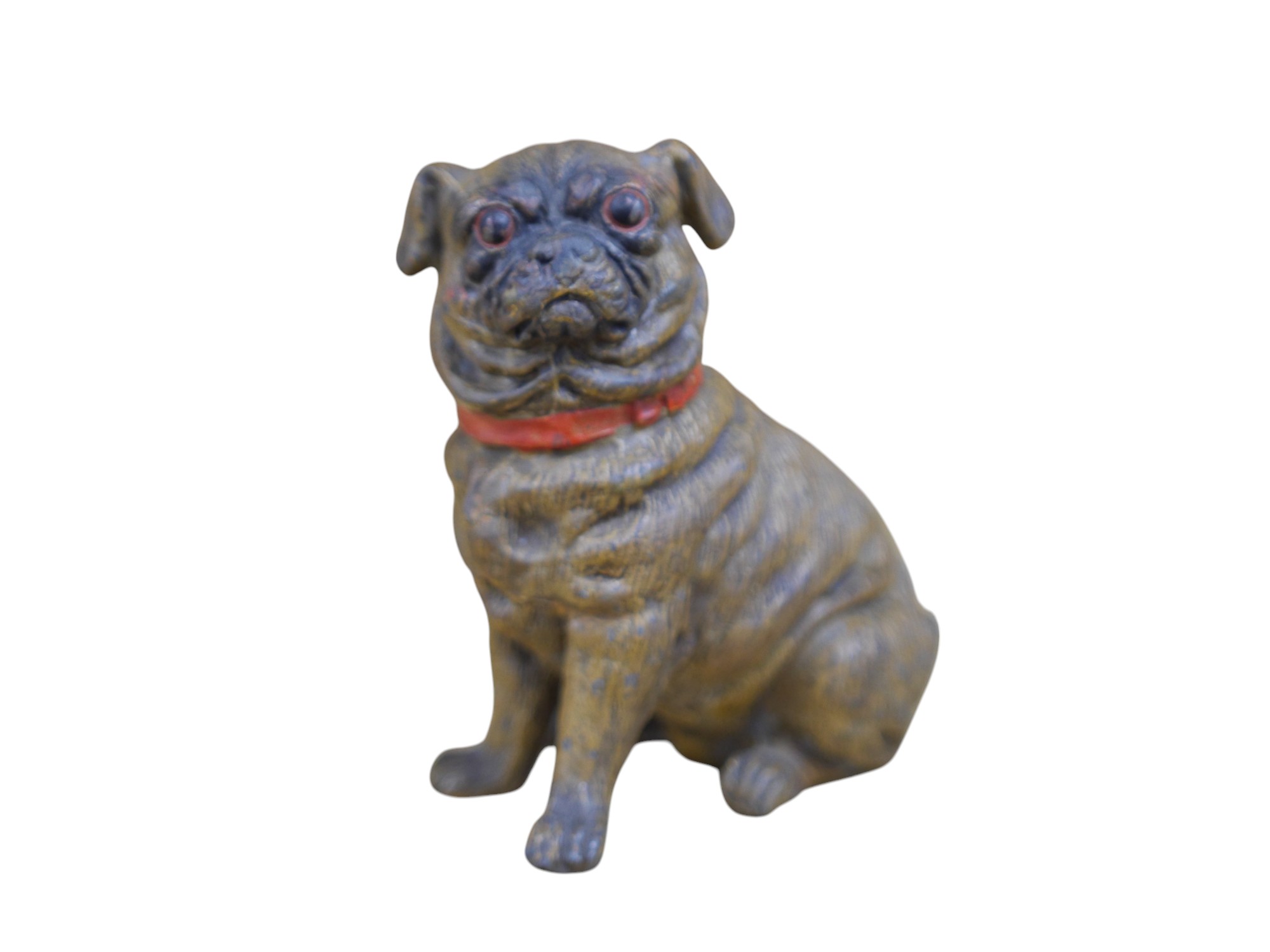 An early 20th century cold painted metal pug dog, 10.5cm high. Condition - good